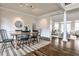 This formal dining room features hardwood floors and transitions into a naturally lit living space at 6355 Indian Acres Trl, Tucker, GA 30084