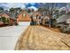 Traditional two-story brick home featuring a well-manicured lawn and attached two-car garage at 6355 Indian Acres Trl, Tucker, GA 30084