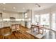 Spacious kitchen with a large island and an adjacent dining area with a view to the backyard at 6355 Indian Acres Trl, Tucker, GA 30084