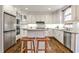 Kitchen featuring stainless appliances, island with seating, and granite countertops at 6355 Indian Acres Trl, Tucker, GA 30084