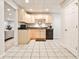 Basement kitchenette featuring light wood cabinetry, tile floors, and modern appliances at 6355 Indian Acres Trl, Tucker, GA 30084