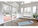 Beautiful sunroom featuring hardwood floors, natural light, and slider to the backyard at 6355 Indian Acres Trl, Tucker, GA 30084