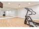 Basement workout room with mirrored wall, exercise equipment, and hardwood floors at 6355 Indian Acres Trl, Tucker, GA 30084