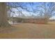 Backyard view of home with carport at 1155 Casteel Rd, Powder Springs, GA 30127