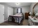 Bedroom with metal bed frame, dresser, and carpet flooring at 1155 Casteel Rd, Powder Springs, GA 30127