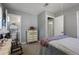 Bedroom with metal bed frame, dresser, and carpet flooring at 1155 Casteel Rd, Powder Springs, GA 30127