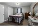 Cozy bedroom featuring soft lighting, a neutral color palette, and built-in closet at 1155 Casteel Rd, Powder Springs, GA 30127