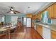 Spacious dining area adjacent to the kitchen, featuring a large table and hardwood floors at 1155 Casteel Rd, Powder Springs, GA 30127