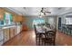 Bright dining area with hardwood floors and seating for many at 1155 Casteel Rd, Powder Springs, GA 30127