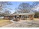 Brick ranch house with stone accents and a long driveway at 1155 Casteel Rd, Powder Springs, GA 30127