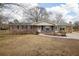 Brick ranch house with landscaped yard at 1155 Casteel Rd, Powder Springs, GA 30127