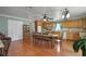 Large kitchen with wooden cabinets, hardwood floors, and an eat-in dining area at 1155 Casteel Rd, Powder Springs, GA 30127