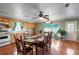 Large kitchen and dining area featuring natural wood cabinetry, an eat-in table, and backyard access at 1155 Casteel Rd, Powder Springs, GA 30127