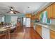 Eat-in kitchen features wood cabinets, updated appliances, and plenty of room at 1155 Casteel Rd, Powder Springs, GA 30127