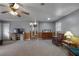 Comfortable living room with wood paneling, carpet, and a view of the hallway at 1155 Casteel Rd, Powder Springs, GA 30127