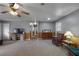 Open-concept living room with comfortable seating, wood accents, and natural light streaming through the windows at 1155 Casteel Rd, Powder Springs, GA 30127