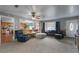 Comfortable living area with views into the kitchen, featuring a mix of textures and ample seating options at 1155 Casteel Rd, Powder Springs, GA 30127