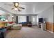 Spacious living room with L-shaped sofa and wood accents at 1155 Casteel Rd, Powder Springs, GA 30127