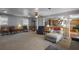 Spacious carpeted living room featuring natural light, classic wood paneling, and cozy seating arrangements at 1155 Casteel Rd, Powder Springs, GA 30127