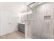 Updated bathroom with tile shower and gray vanity with white countertop, ample storage and double closet at 6006 Lanier Heights Cir, Buford, GA 30518