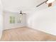 Expansive bedroom featuring dual ceiling fans, and natural light at 6006 Lanier Heights Cir, Buford, GA 30518