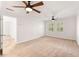 Large bedroom featuring hardwood floors in the doorway, and dual ceiling fans at 6006 Lanier Heights Cir, Buford, GA 30518