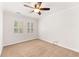 Inviting bedroom offers natural light from large windows, carpeting and ceiling fan at 6006 Lanier Heights Cir, Buford, GA 30518