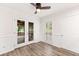Bright dining area with French doors leading to a screened-in porch at 6006 Lanier Heights Cir, Buford, GA 30518