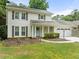 Charming two-story traditional home with a well-maintained lawn and an attached two-car garage at 6006 Lanier Heights Cir, Buford, GA 30518
