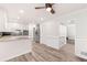 Well-lit kitchen with stainless steel appliances, white cabinets, and granite countertops at 6006 Lanier Heights Cir, Buford, GA 30518