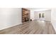 Spacious living room featuring hardwood floors and a rustic fireplace at 6006 Lanier Heights Cir, Buford, GA 30518