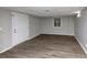 Spacious basement with wood-look flooring and a door to the outside at 4025 Casa Verde Dr, Atlanta, GA 30349