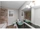 Updated bathroom with glass sink and tile shower at 4025 Casa Verde Dr, Atlanta, GA 30349