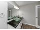 Updated bathroom with double sinks, granite countertop, and modern fixtures at 4025 Casa Verde Dr, Atlanta, GA 30349