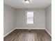 Spacious bedroom with hardwood floors and large window at 4025 Casa Verde Dr, Atlanta, GA 30349