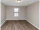 Spacious bedroom with hardwood floors and a window at 4025 Casa Verde Dr, Atlanta, GA 30349