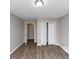 Simple bedroom with hardwood floors and double doors to hallway at 4025 Casa Verde Dr, Atlanta, GA 30349
