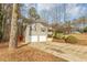 Two-car garage with a house in the background at 4025 Casa Verde Dr, Atlanta, GA 30349