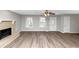 Spacious living room with fireplace and wood-look floors at 4025 Casa Verde Dr, Atlanta, GA 30349