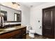 Clean bathroom with granite countertop and dark wood cabinets at 1206 Red Fox Cir, Woodstock, GA 30188