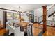 Spacious dining area with a long wooden table and white seating at 1206 Red Fox Cir, Woodstock, GA 30188