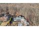 Aerial view of house, showcasing its location in a wooded setting at 3939 Hamilton Mill Rd, Buford, GA 30519