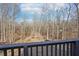 View from deck showcasing a wooded backyard at 3939 Hamilton Mill Rd, Buford, GA 30519