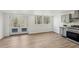 Spacious basement with wood-look floors, kitchen, and access to backyard at 3939 Hamilton Mill Rd, Buford, GA 30519