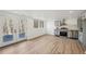 Spacious basement with wood-look floors, kitchen, and access to backyard at 3939 Hamilton Mill Rd, Buford, GA 30519