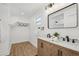 Contemporary bathroom with double vanity and light wood cabinets at 3939 Hamilton Mill Rd, Buford, GA 30519