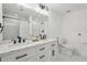 Modern bathroom with double vanity, marble tile, and shower at 3939 Hamilton Mill Rd, Buford, GA 30519