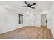 Bright bedroom featuring hardwood floors and ceiling fan at 3939 Hamilton Mill Rd, Buford, GA 30519