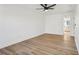 Bright bedroom with hardwood floors and ceiling fan at 3939 Hamilton Mill Rd, Buford, GA 30519
