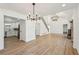 Open concept dining room with hardwood floors and two large chandeliers at 3939 Hamilton Mill Rd, Buford, GA 30519